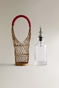 GLASS CRUET WITH RATTAN BASKET