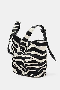 MINI SAC SEAU SOUPLE EN CUIR ASYMÉTRIQUE