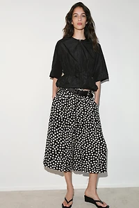 PANTALON JUPE-CULOTTE À POIS AVEC CEINTURE