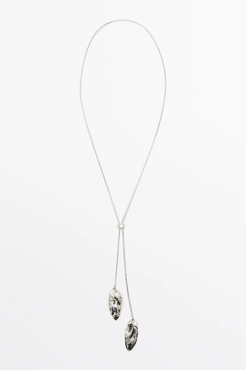 Adjustable necklace with textured pieces