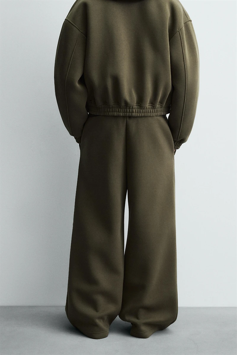 WIDE FIT NEOPRENE EFFECT PANTS WITH STUDS