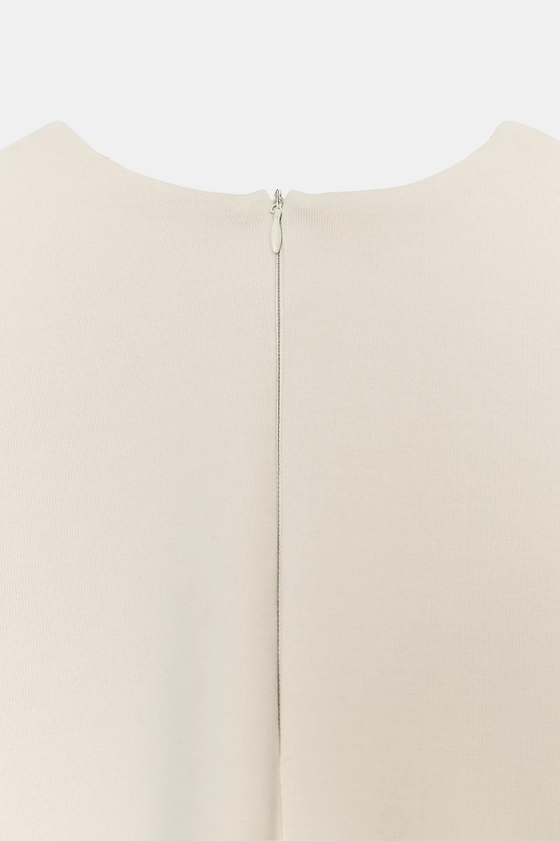 ASYMMETRIC INTERLOCK CAPE