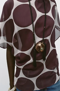 TOP SEMI-TRANSPARENT À POIS