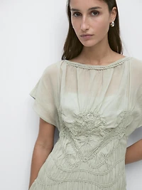 Long flowing dress with embroidered details