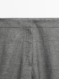 Balloon fit trousers with button details