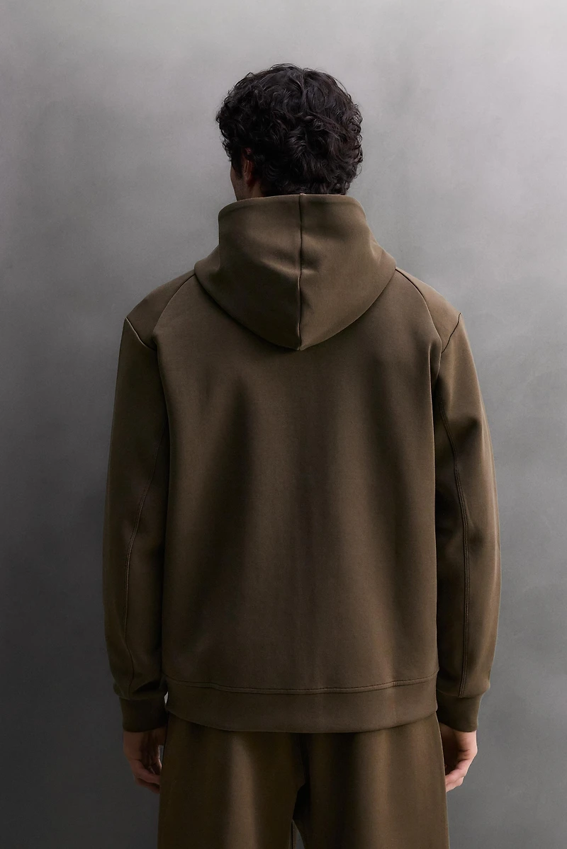 SWEAT TECHNIQUE ZIPPÉ À CAPUCHE