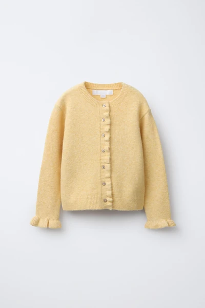 GILET EN MAILLE VOLANTS AVEC LAINE