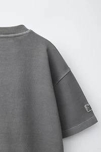 T-SHIRT INTERLOCK TEINT EN PIÈCE
