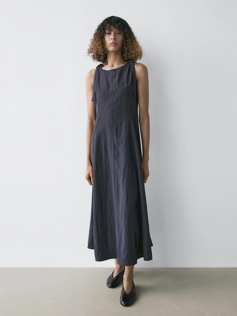 Flowing midi dress with buckles