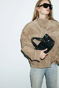 HANDBAG WITH METALLIC DETAILS
