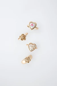 FOUR-PACK OF FLOWER AND HEART RINGS