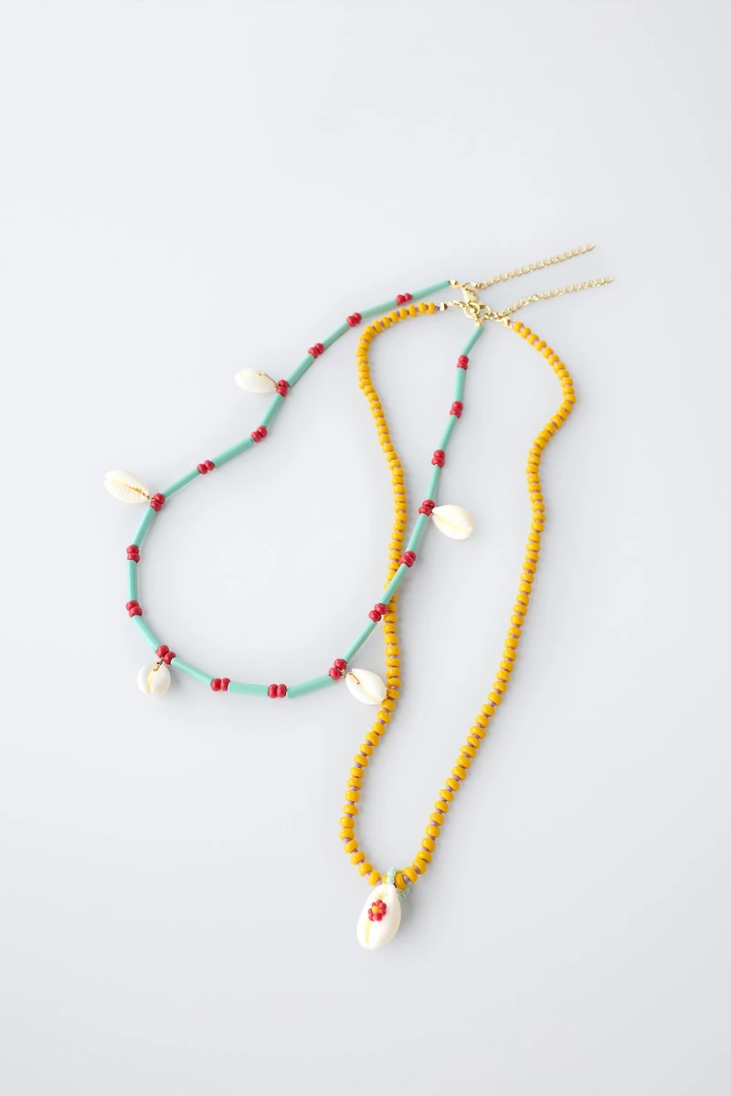 PACK OF TWO BEADED SHELL NECKLACES
