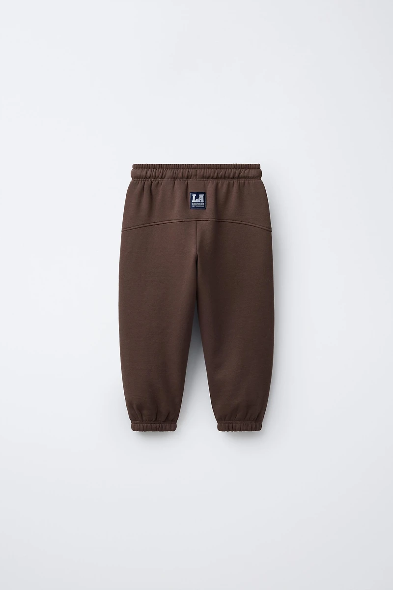 EMBROIDERED ANIMAL NUMBER JOGGING PANTS