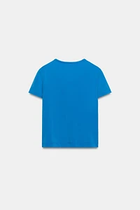T-SHIRT TEXTE BRILLANT EFFET DÉLAV