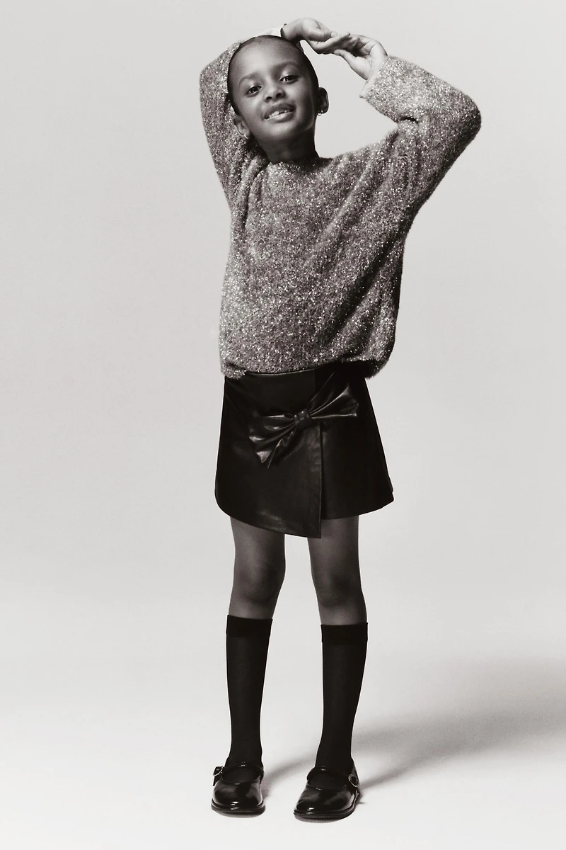 JUPE-SHORT AVEC NŒUD EN MATIÈRE SYNTHÉTIQUE