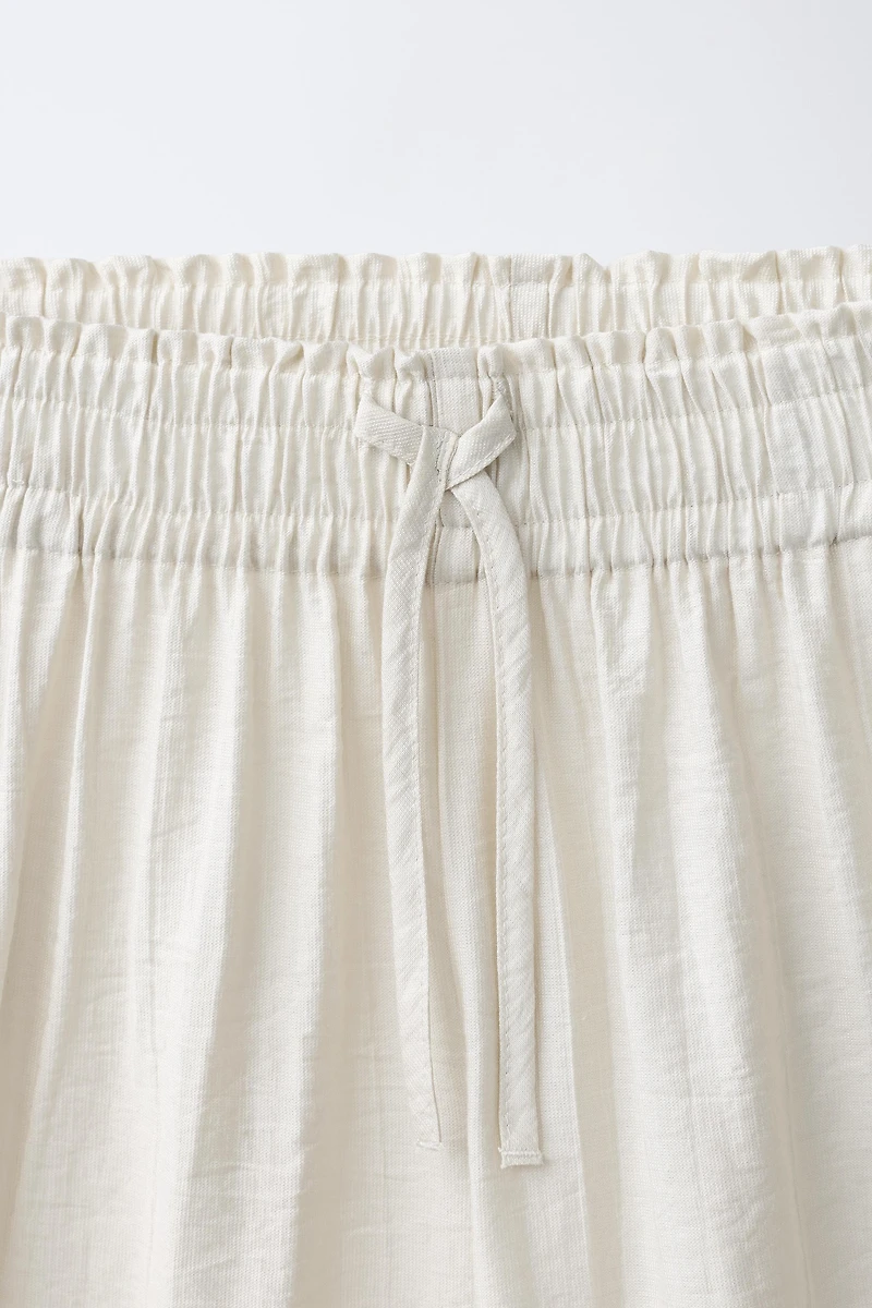 PANTALON À JAMBES LARGES EFFET FROISSÉ