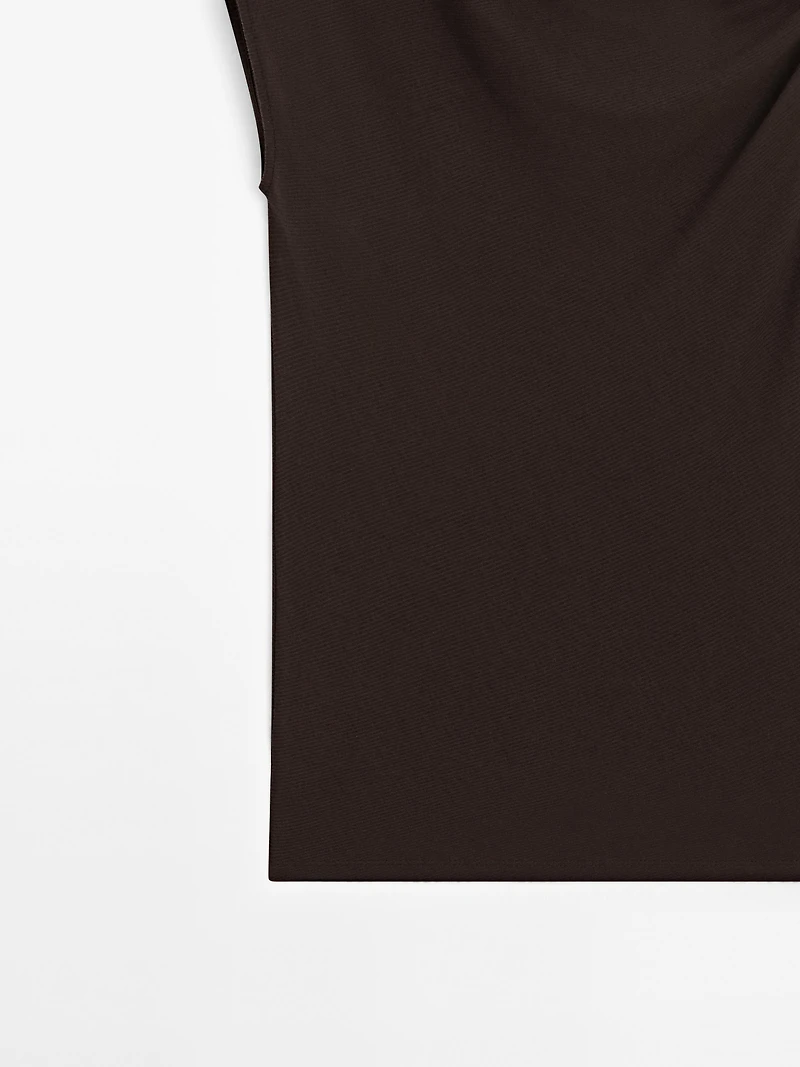Asymmetric top with knot detail
