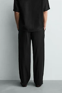 FLOWY RELAXED FIT PLEATED PANTS