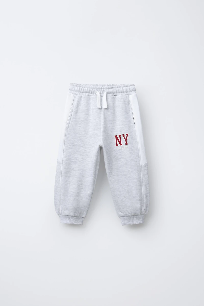 PANTALON DE JOGGING À BANDES LATÉRALES