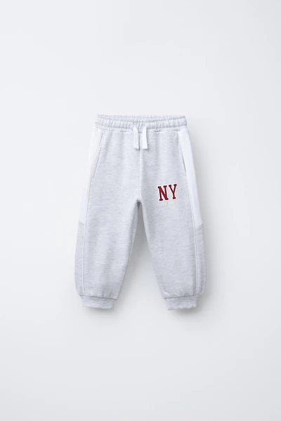 PANTALON DE JOGGING À BANDES LATÉRALES