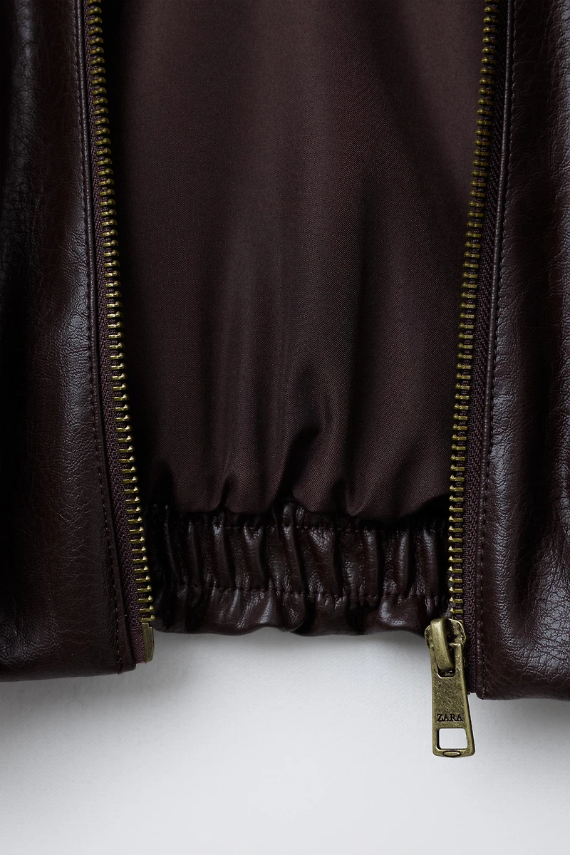 BLOUSON EN MATIÈRE SYNTHÉTIQUE