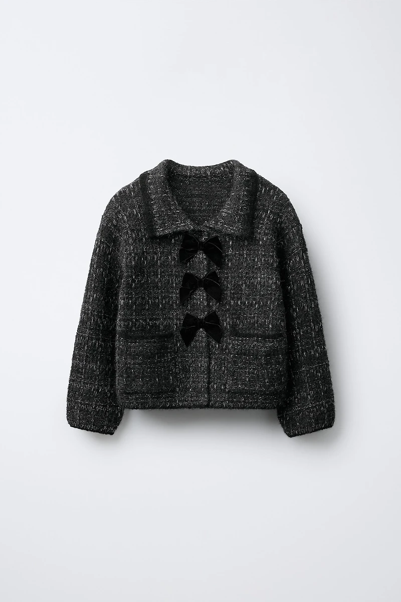 GILET EN MAILLE PAILLETTES ET NŒUDS VELOURS