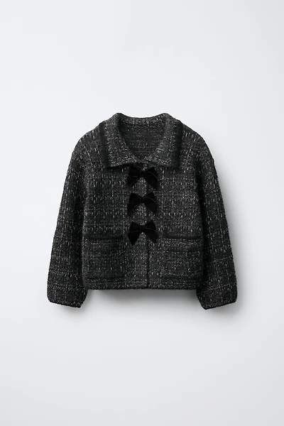 GILET EN MAILLE PAILLETTES ET NŒUDS VELOURS