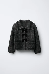 GILET EN MAILLE PAILLETTES ET NŒUDS VELOURS