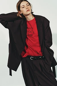 PLEATED PANTS WITH BUTTON HEM
