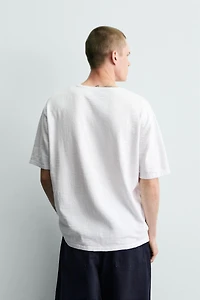 T-SHIRT EN MAILLE STRUCTURÉE FLAMMÉE