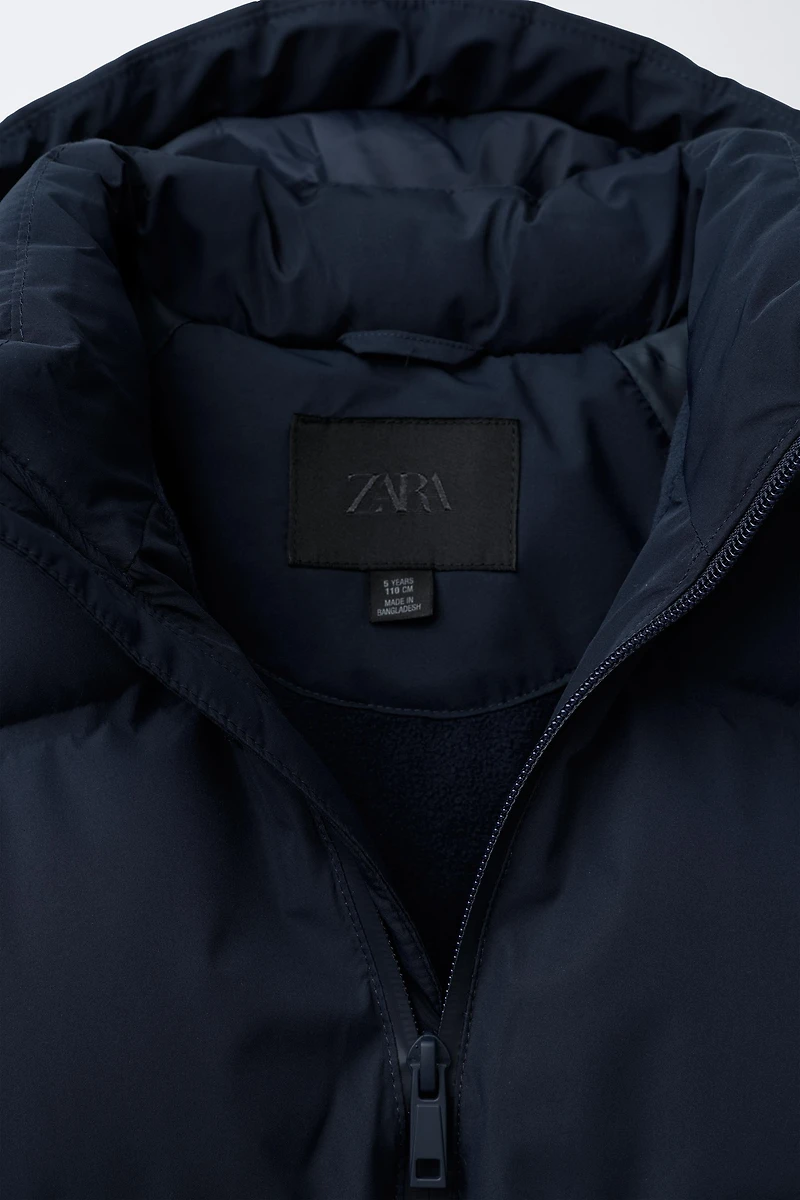 BLOUSON MATELASSÉ À CAPUCHE DÉPERLANT