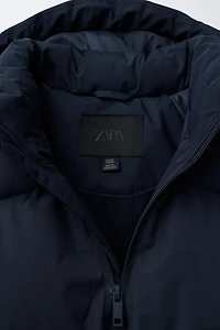 BLOUSON MATELASSÉ À CAPUCHE DÉPERLANT