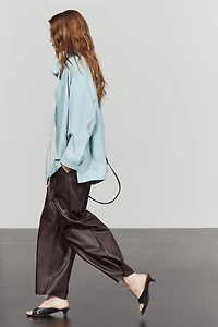 Flowing shirt with high collar and drawstring detail