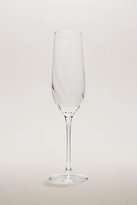 CRYSTALLINE FLUTE GLASS WITH RAISED DESIGN