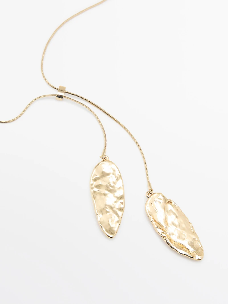 Adjustable necklace with textured pieces