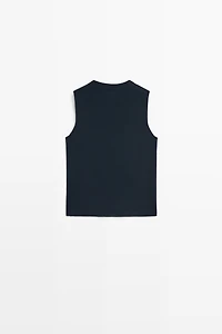 Fine-knit vest with covered buttons
