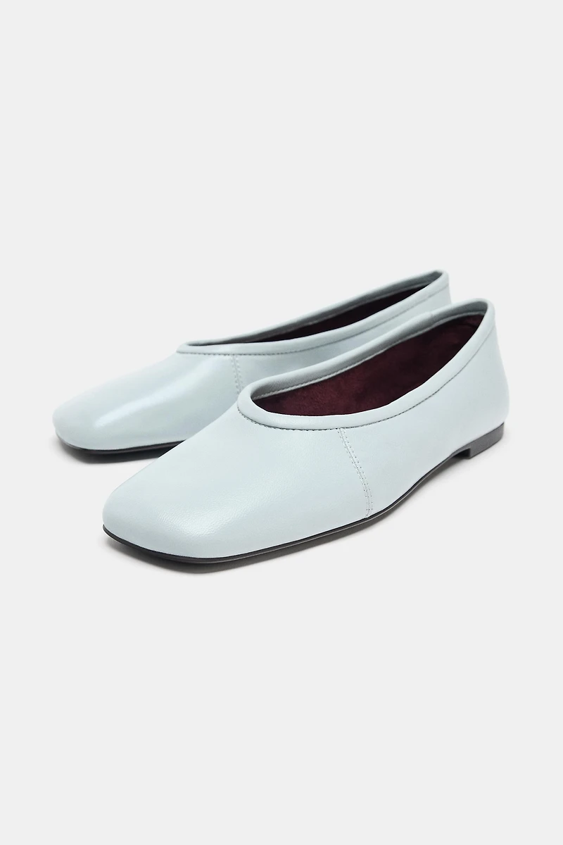 BALLERINES EN CUIR AVEC SURPIQÛRES