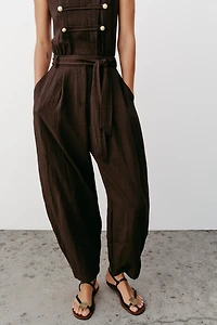 BELTED JUMPSUIT WITH BUTTON DETAILS