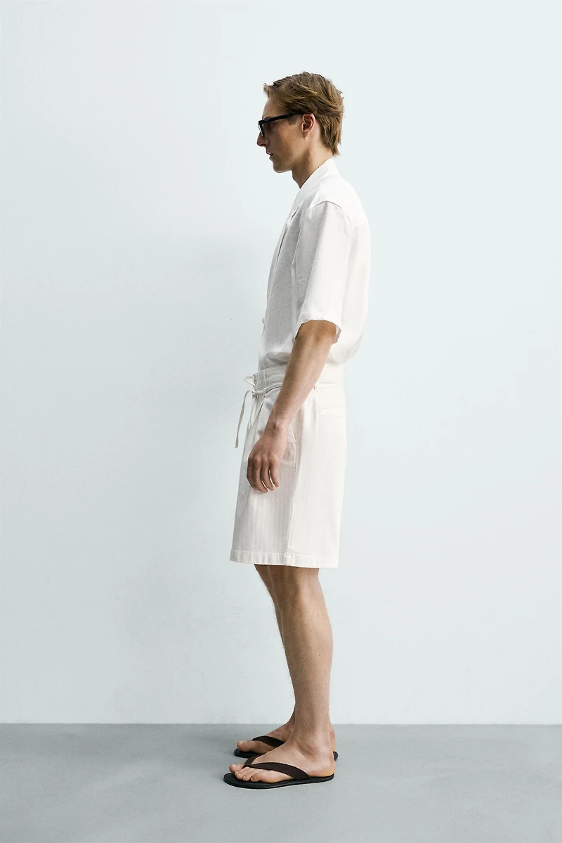 RELAXED FIT PLEATED SHORTS