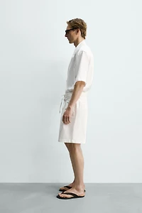 RELAXED FIT PLEATED SHORTS