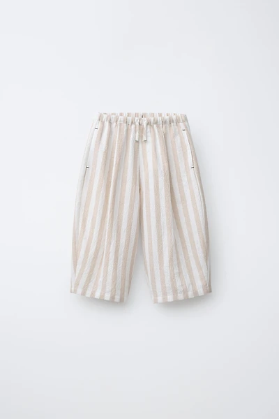 PANTALON BALLON À PLIS ET RAYURES