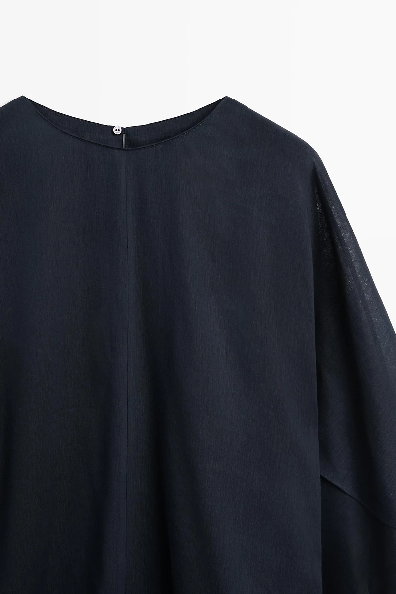 Asymmetric flowing cape