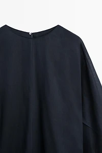 Asymmetric flowing cape