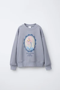 SWEAT IMPRIMÉ FLEURS ET DÉTAIL CROCHET