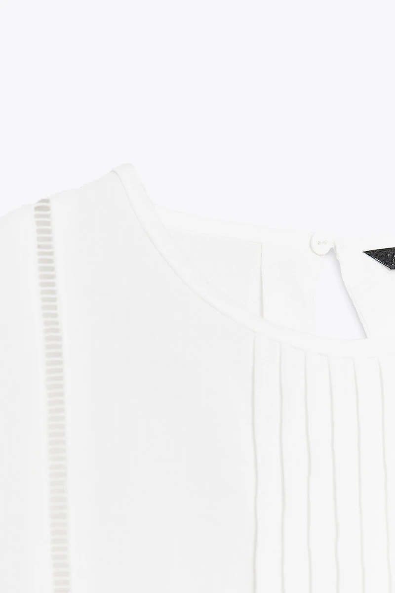 BLOUSE PÉPLUM ENTRE-DEUX