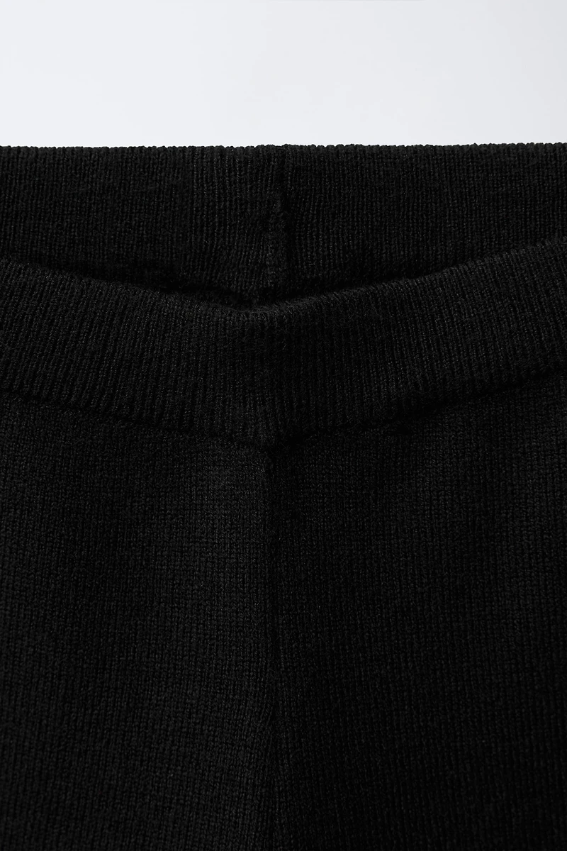 FLARED KNIT PANTS WITH BOWS AND RUFFLE