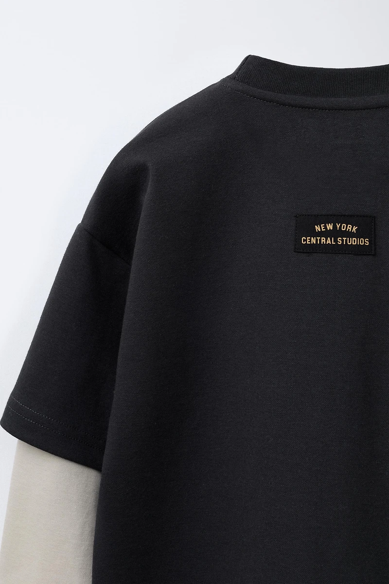 VARSITY INTERLOCK DOUBLE SLEEVE SWEATSHIRT