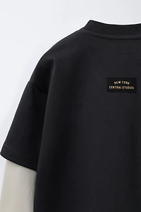 VARSITY INTERLOCK DOUBLE SLEEVE SWEATSHIRT