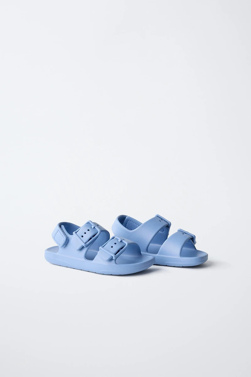 RUBBERIZED BUCKLED SANDALS
