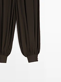 Semi-sheer sarouel trousers with button details